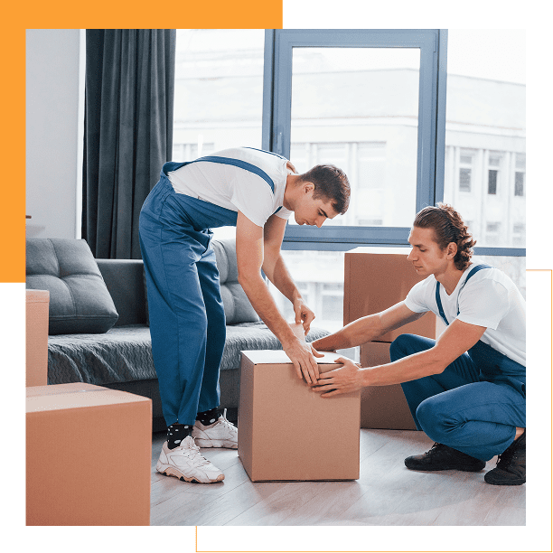 Two men packing boxes in a new home.