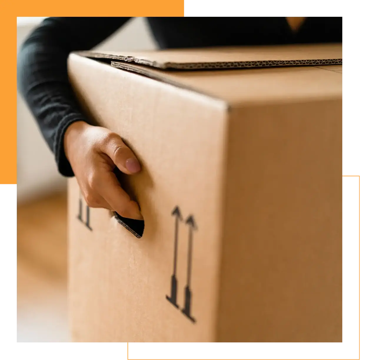 Person carrying a cardboard box with arrows pointing up.